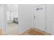 Bright foyer featuring tile flooring at entry, with view of bedroom with neutral carpet and ample natural light at 3695 Quail St, Wheat Ridge, CO 80033