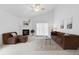 Spacious living room with high ceilings, fireplace, and lots of natural light at 3695 Quail St, Wheat Ridge, CO 80033