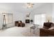 Bright living room with fireplace, vaulted ceiling and comfortable seating at 3695 Quail St, Wheat Ridge, CO 80033