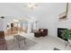 Open concept living room with adjacent dining area and kitchen view at 3695 Quail St, Wheat Ridge, CO 80033