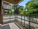 Balcony with treetop views for a relaxing outdoor experience at 2500 S York St # 204, Denver, CO 80210