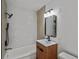 Modern bathroom with updated fixtures and a stylish wood vanity at 2500 S York St # 204, Denver, CO 80210