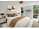 Bright bedroom with large windows and neutral decor, creating a serene atmosphere at 2500 S York St # 204, Denver, CO 80210