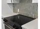Modern kitchen cooktop with quartz countertop, ready for cooking at 2500 S York St # 204, Denver, CO 80210