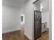 Open view leading into kitchen showing stainless steel refrigerator at 2500 S York St # 204, Denver, CO 80210