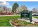 Sign for S.R. Deboer Park features manicured lawn, basketball court, playground and mature trees at 2500 S York St # 204, Denver, CO 80210