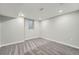 Spacious finished basement with neutral carpeting and recessed lighting at 4735 W Bayaud Ave, Denver, CO 80219