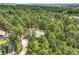 Aerial view of secluded home surrounded by dense forest of trees at 19165 Golden Arrow Cir, Monument, CO 80132