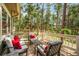 Inviting back deck including outdoor seating, bordered by tall trees for privacy at 19165 Golden Arrow Cir, Monument, CO 80132