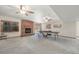 Finished basement with brick fireplace, exposed windows, and ping pong table at 19165 Golden Arrow Cir, Monument, CO 80132