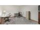 Finished basement area offering multiple workspaces with desks, chairs, and storage at 19165 Golden Arrow Cir, Monument, CO 80132