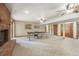 Finished basement area with a brick fireplace and large ping pong table at 19165 Golden Arrow Cir, Monument, CO 80132