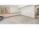 Spacious basement area with carpet flooring and natural light from a window at 19165 Golden Arrow Cir, Monument, CO 80132