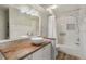 Bathroom featuring a wood counter with stylish sink, modern vanity, and shower at 19165 Golden Arrow Cir, Monument, CO 80132