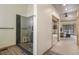 Bathroom with glass-enclosed shower featuring river stone flooring and access to bedroom at 19165 Golden Arrow Cir, Monument, CO 80132