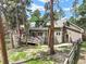 Two-story house with large deck and stairs down to a beautiful, green lawn at 19165 Golden Arrow Cir, Monument, CO 80132