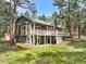 Two-story house with multi-level deck and lush, green lawn at 19165 Golden Arrow Cir, Monument, CO 80132
