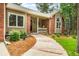Inviting brick and tan home featuring a cozy front porch and a well-manicured walkway at 19165 Golden Arrow Cir, Monument, CO 80132