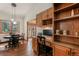Home office featuring wooden built-ins with desk space and a separate breakfast nook with natural light at 19165 Golden Arrow Cir, Monument, CO 80132