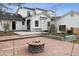 Relaxing backyard features a stone fire pit perfect for entertaining guests at 815 E Westglow Ln, Greenwood Village, CO 80121