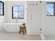 Serene bathroom featuring a standalone tub and glass-enclosed shower at 815 E Westglow Ln, Greenwood Village, CO 80121