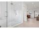 Modern bathroom features a glass-enclosed shower with white tile and a built-in bench at 815 E Westglow Ln, Greenwood Village, CO 80121