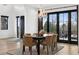 Cozy dining area with stylish chandelier, view to the deck, and an intimate setting for meals at 815 E Westglow Ln, Greenwood Village, CO 80121