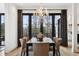 Refined dining space with modern lighting, soft textures, and expansive views for elegant entertaining at 815 E Westglow Ln, Greenwood Village, CO 80121