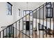 Stunning entryway featuring a modern chandelier and staircase with iron railings at 815 E Westglow Ln, Greenwood Village, CO 80121