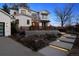 Stylish two-story home with inviting illuminated walkway and thoughtfully designed landscaping offering privacy at 815 E Westglow Ln, Greenwood Village, CO 80121