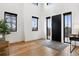 Bright foyer featuring hardwood floors, black framed windows, and high ceilings for a grand entrance at 815 E Westglow Ln, Greenwood Village, CO 80121