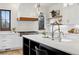 Well-lit kitchen with stainless steel appliances, a large island, and light countertops at 815 E Westglow Ln, Greenwood Village, CO 80121