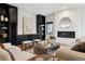 Open-concept living room featuring a fireplace, natural light, and neutral decor at 815 E Westglow Ln, Greenwood Village, CO 80121