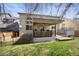 Great back yard with lawn, fence, and deck with grill and hot tub at 468 Sylvestor Trl, Highlands Ranch, CO 80129