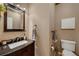 Powder room with granite countertop and black fixtures at 468 Sylvestor Trl, Highlands Ranch, CO 80129