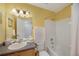 Bright full bath with white tile, tub, and vanity at 468 Sylvestor Trl, Highlands Ranch, CO 80129