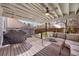 Inviting covered deck with comfortable seating, a ceiling fan, and grill, perfect for outdoor entertaining at 468 Sylvestor Trl, Highlands Ranch, CO 80129