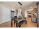 Dining area with a rustic wooden table next to the kitchen at 468 Sylvestor Trl, Highlands Ranch, CO 80129