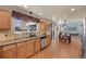 Updated kitchen with stainless steel appliances, wooden cabinets, and granite countertops at 468 Sylvestor Trl, Highlands Ranch, CO 80129