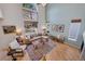 Bright living room with high ceilings, hardwood floors, comfortable seating, and natural light pouring through large windows at 468 Sylvestor Trl, Highlands Ranch, CO 80129