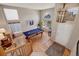 Bright living room with pool table, hardwood floors, and abundant natural light at 468 Sylvestor Trl, Highlands Ranch, CO 80129