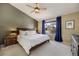 Comfortable main bedroom featuring a ceiling fan and large window at 468 Sylvestor Trl, Highlands Ranch, CO 80129