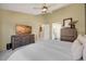 Spacious main bedroom with a ceiling fan and access to the bathroom at 468 Sylvestor Trl, Highlands Ranch, CO 80129