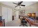Home office area with two-tone paint, fan, and a multi-screen workstation at 468 Sylvestor Trl, Highlands Ranch, CO 80129