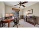 Home office featuring a ceiling fan and large window for natural light at 468 Sylvestor Trl, Highlands Ranch, CO 80129