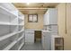 Basement with storage, white cabinets and shelving, and a small window at 346 N Corona St, Denver, CO 80218