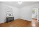 Clean bedroom features wood floors, and a window with air conditioning unit at 346 N Corona St, Denver, CO 80218