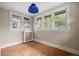 Bright bedroom with wood floors, white trim, and large windows at 346 N Corona St, Denver, CO 80218