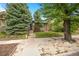 Charming brick home with mature trees and a well-manicured lawn at 346 N Corona St, Denver, CO 80218
