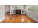 Sun-filled living room with hardwood floors and a decorative fireplace at 346 N Corona St, Denver, CO 80218